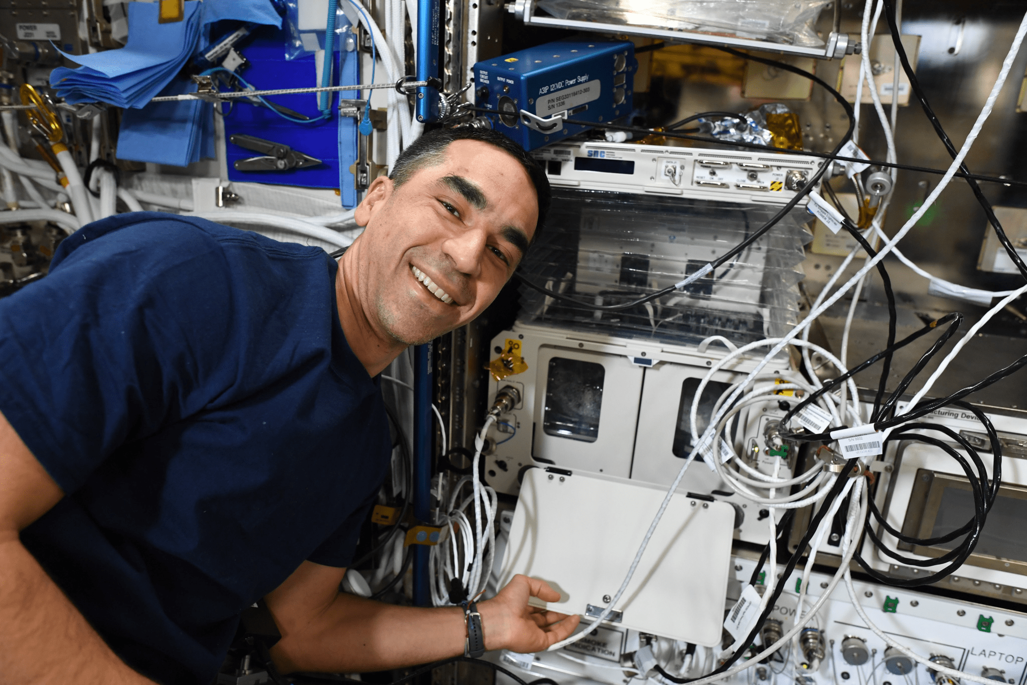 image of an astronaut working with an experiment