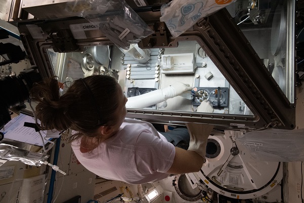 image of an astronaut working on an experiment