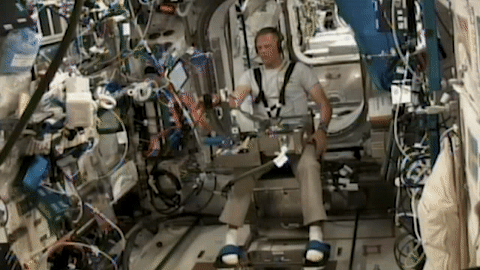 moving image of an astronaut running an experiment