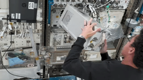 moving image of an astronaut installing hardware