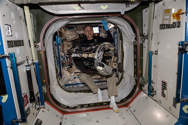 image of an astronaut working on an experiment