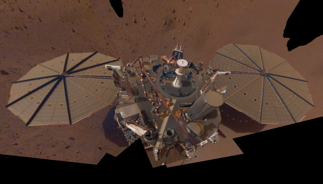 A thin layer of Martian dust can be seen coating InSight in this selfie taken by the Instrument Deployment Camera on the lander’s robotic arm.