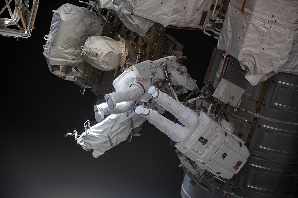 image of two astronauts during a spacewalk