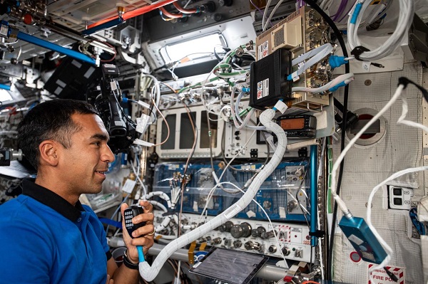 image of an astronaut using a Ham radio
