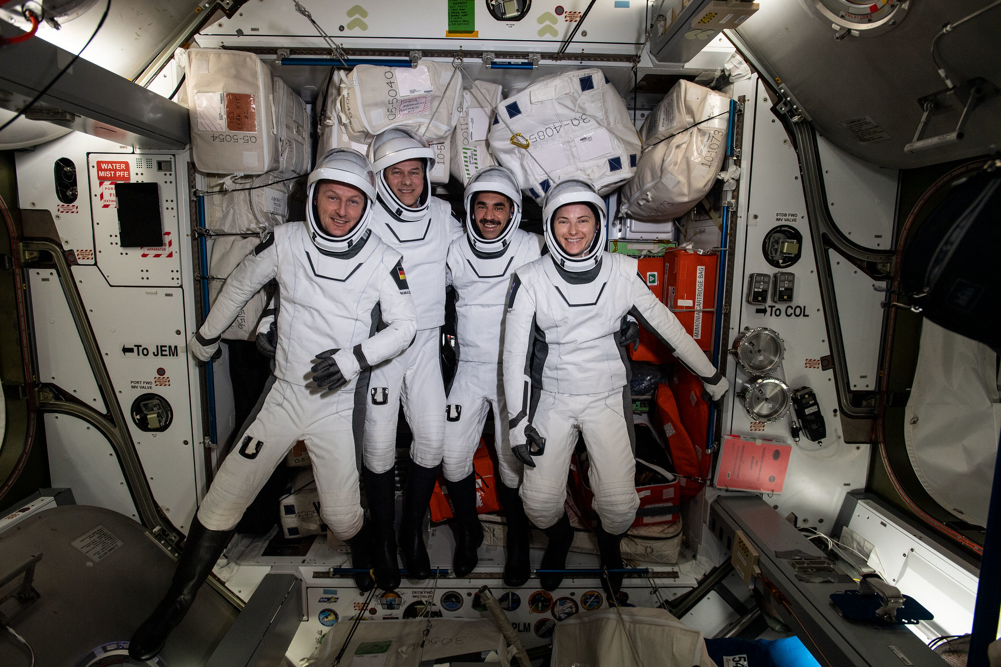 The four commercial crew astronauts representing NASA’s SpaceX Crew-3 mission are pictured in their Dragon spacesuits for a fit check aboard the International Space Station's Harmony module.