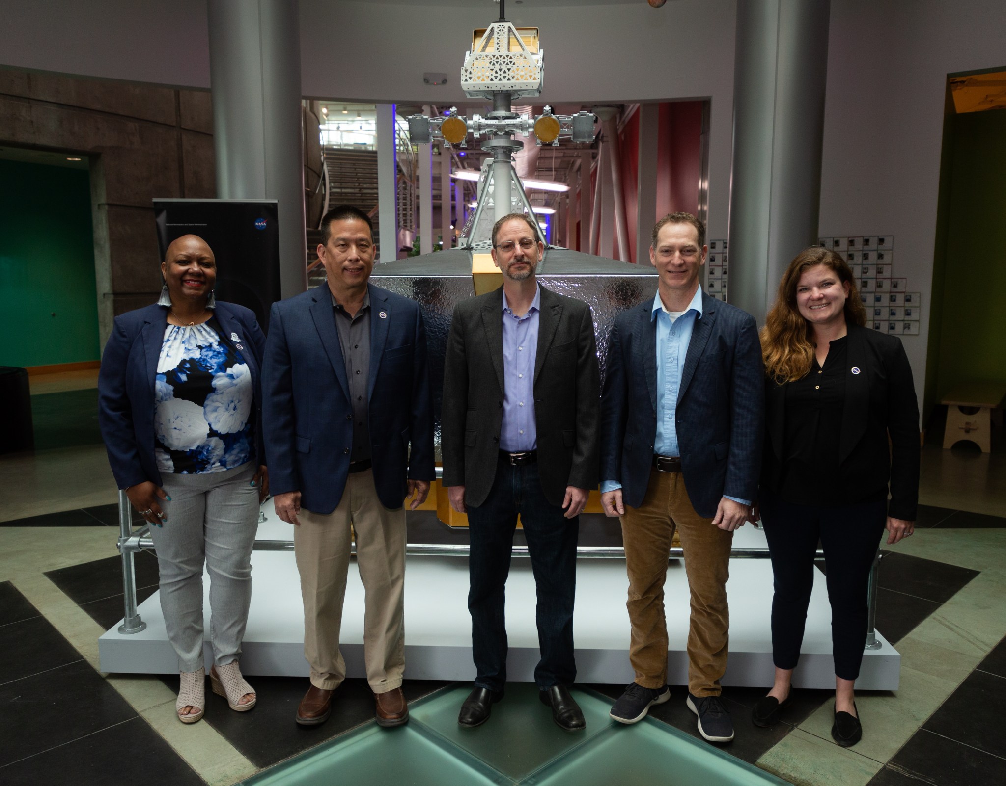 Joeletta Patrick, Director of NASA's California Office of STEM Engagement, Eugene Tu, Ames Center Director, Adam Tobin, Chabot Director, Ryan Vaughan, lead mission systems engineer, Cara Dodge, Ames Event Lead, in front of VIPER model.
