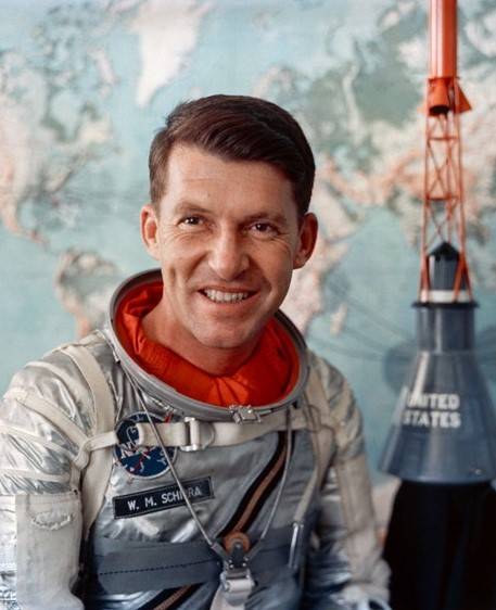 Walter Schirra, Mercury 7 astronaut poses with a model of his Sigma 7 capsule.