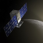 The capstone spacecraft with solar panels open on either side is lit on one side by the sun which is peeking out in the background from behind the darkened Earth.