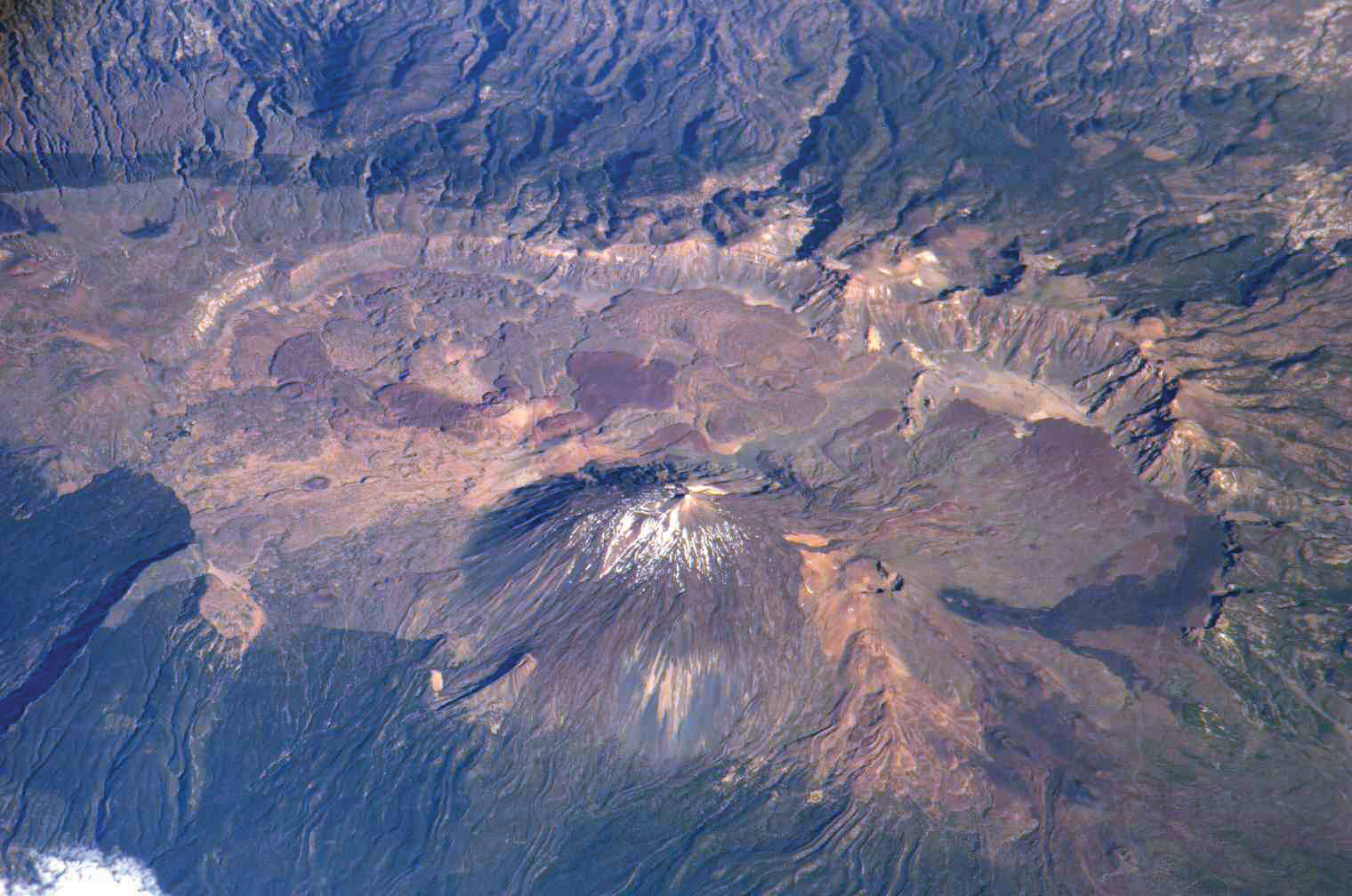 image of a volcano and mountainous region on Earth