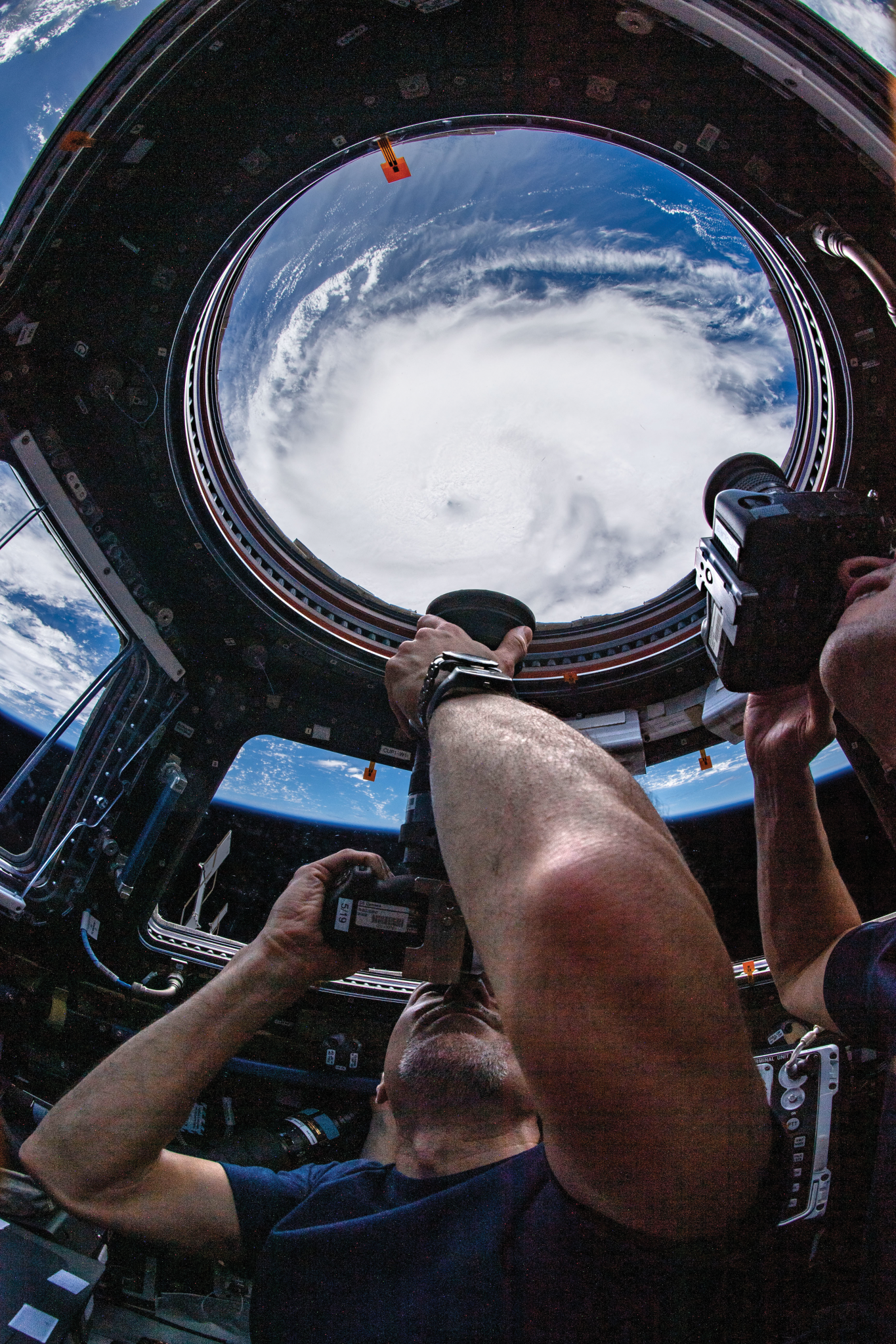 image of an astronaut taking pictures of Earth