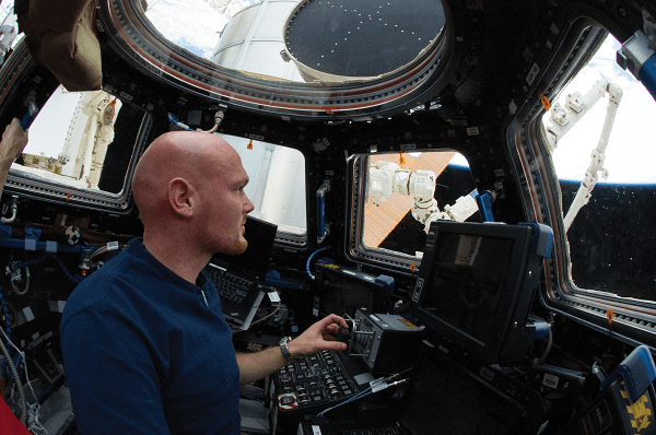 image of an astronaut taking pictures of Earth