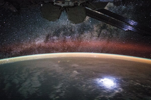 image of Earth at night with stars in backdrop