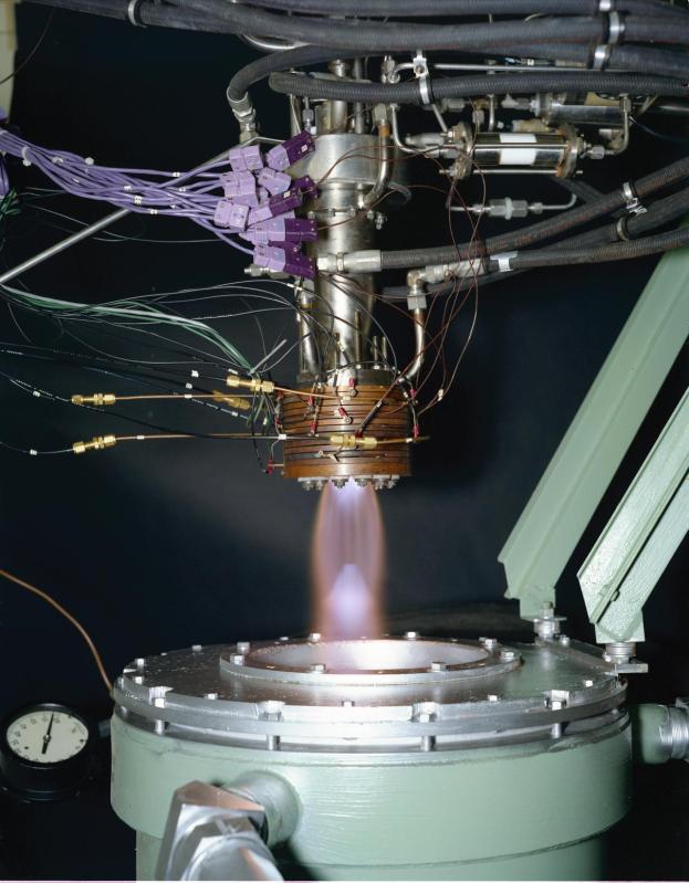 Rig mounted with rocket engine nozzle fires flame into opposite pipe.