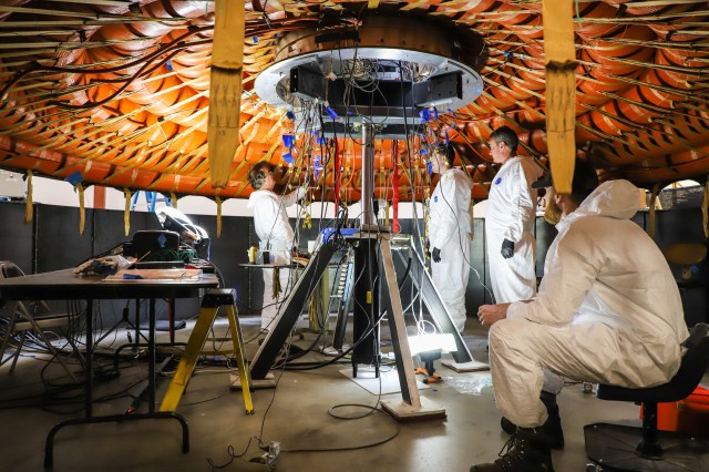 A teams works on NASA’s Low-Earth Orbit Flight Test of an Inflatable Decelerator (LOFTID), dedicated to the memory of Bernard Kutter which will launch as a secondary payload aboard the Joint Polar Satellite System-2 (JPSS-2) mission.