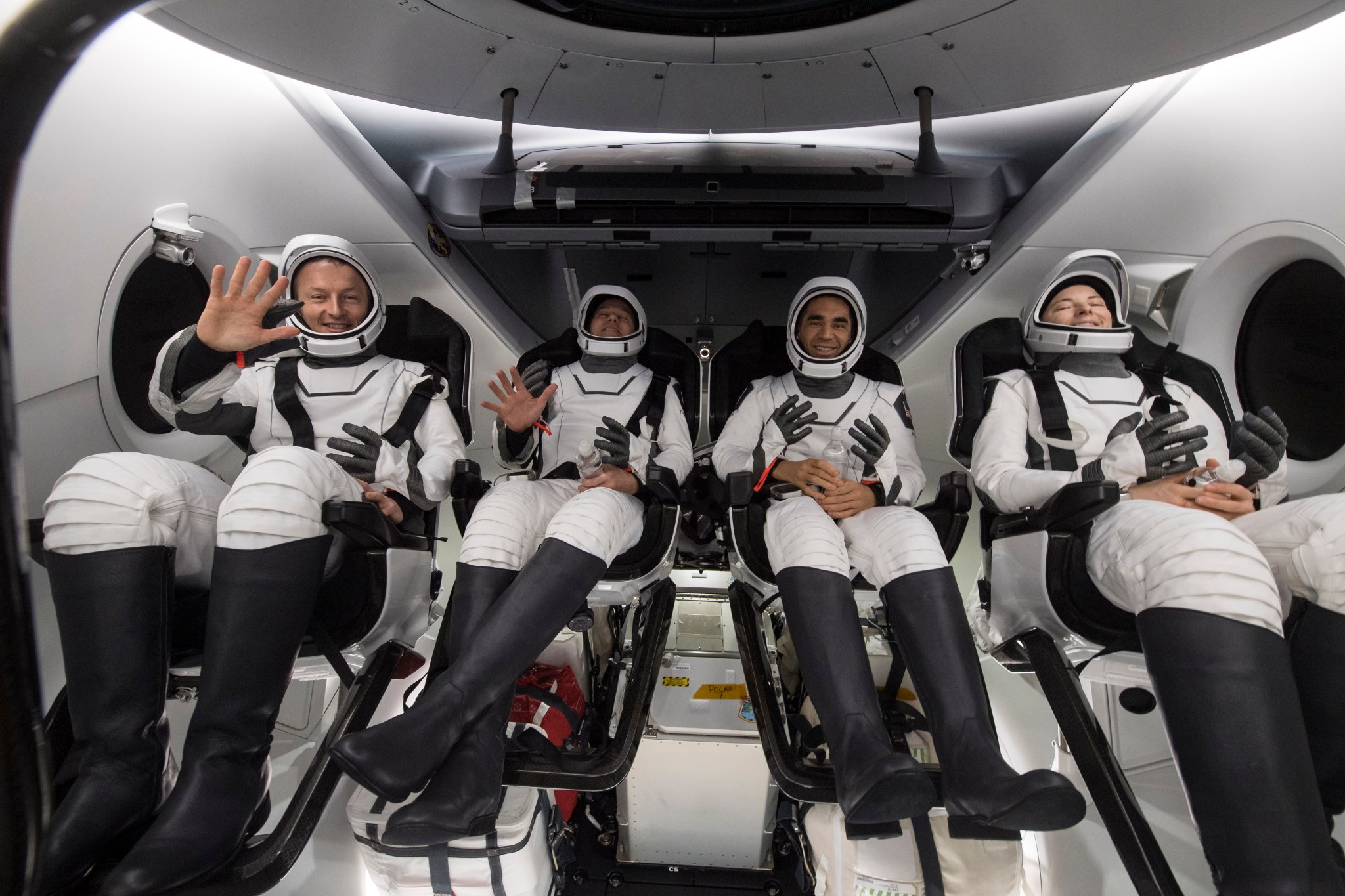 From left to right, ESA (European Space Agency) astronaut Matthais Maurer, NASA astronauts Tom Marshburn, Raja Chari, and Kayla Barron, are seen inside the SpaceX Crew Dragon Endurance spacecraft onboard the SpaceX Shannon recovery ship.