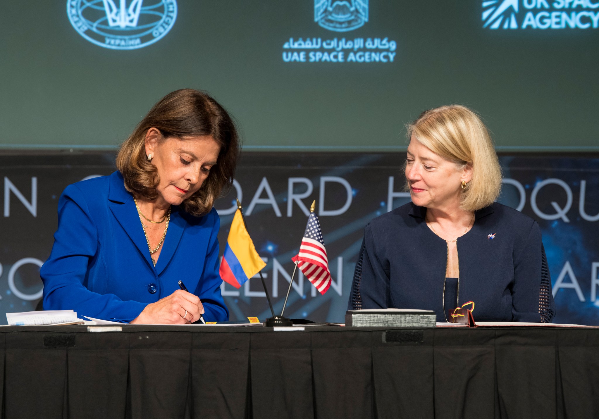 Colombian Vice President and Foreign Minister Marta Lucía Ramírez signs the Artemis Accords as NASA Deputy Administrator Pam Melroy looks on Tuesday, May 10, 2022, at NASA Headquarters in Washington.