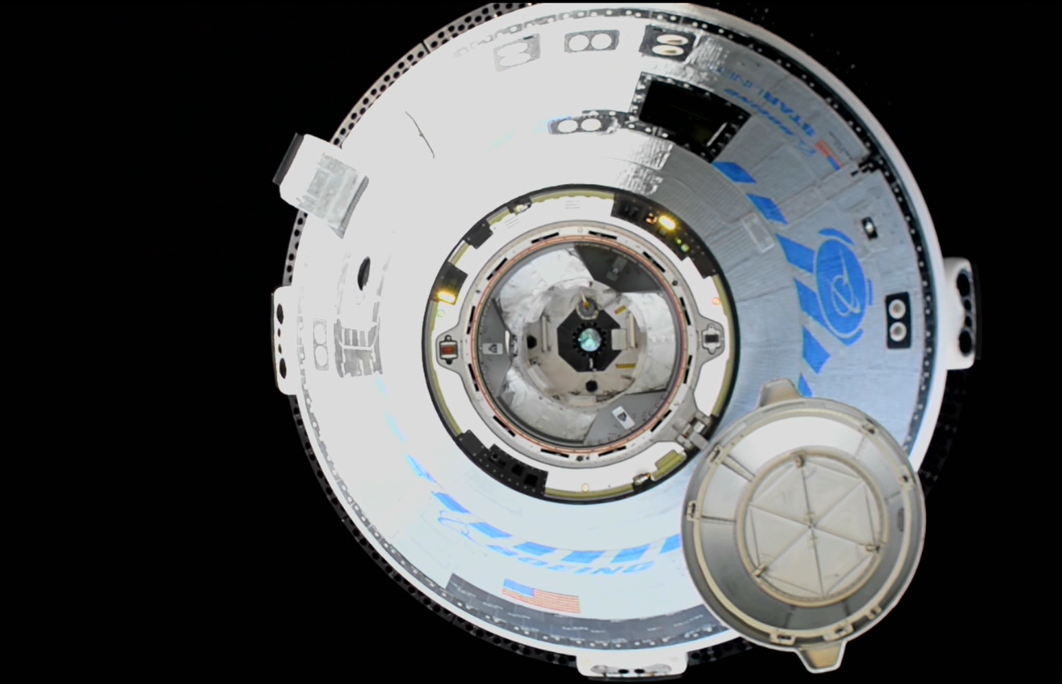 The uncrewed Boeing CST-100 Starliner approaches the forward port of the International Space Station at 8:28 p.m. EDT on Friday, May 20 for the first time during NASA's Boeing Orbital Flight Test-2.
