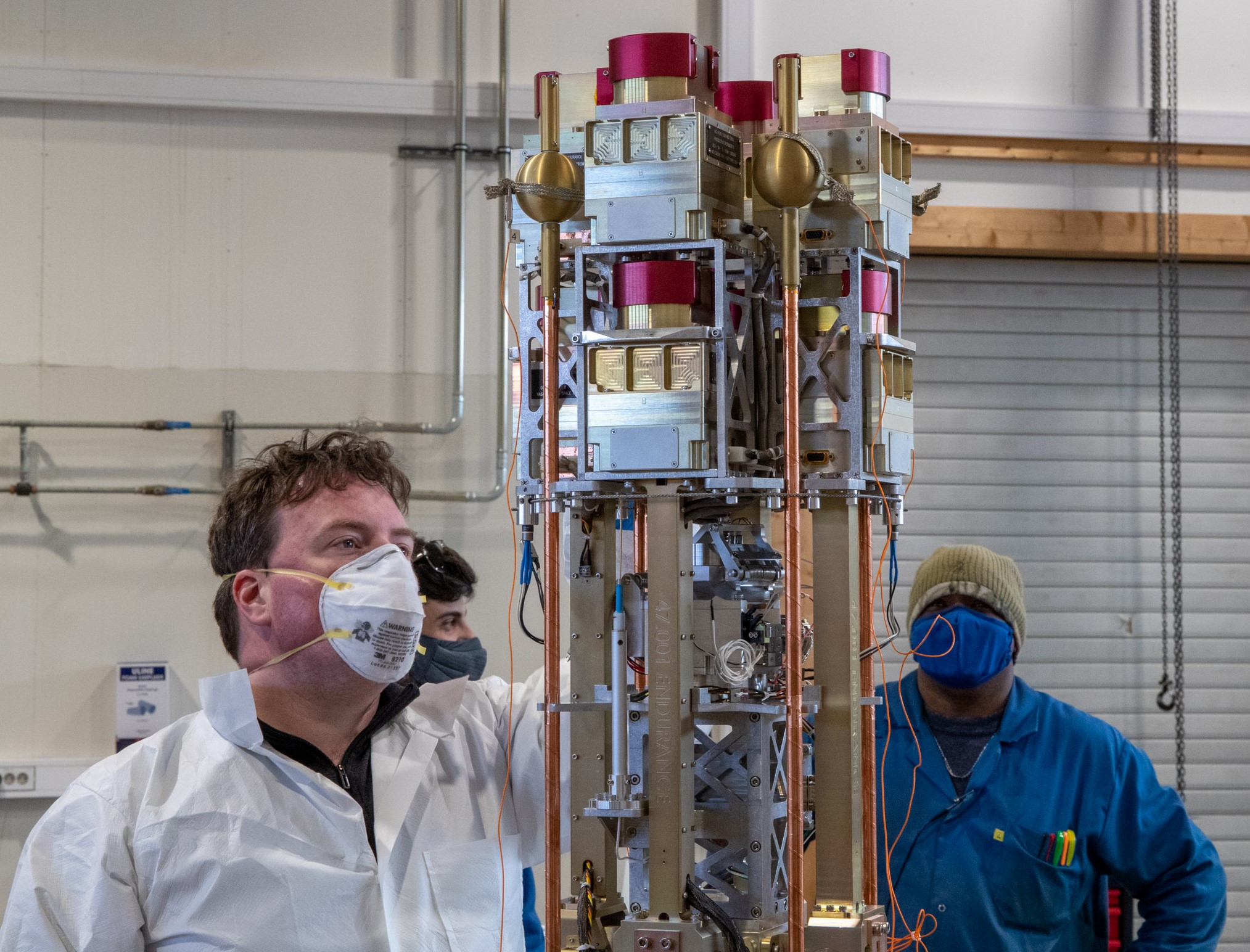 Man looking at uncovered rocket instrument