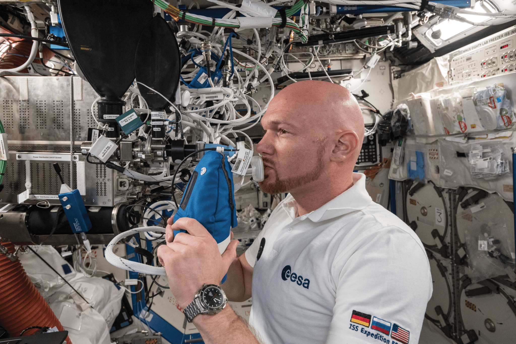 image of an astronaut working with an experiment