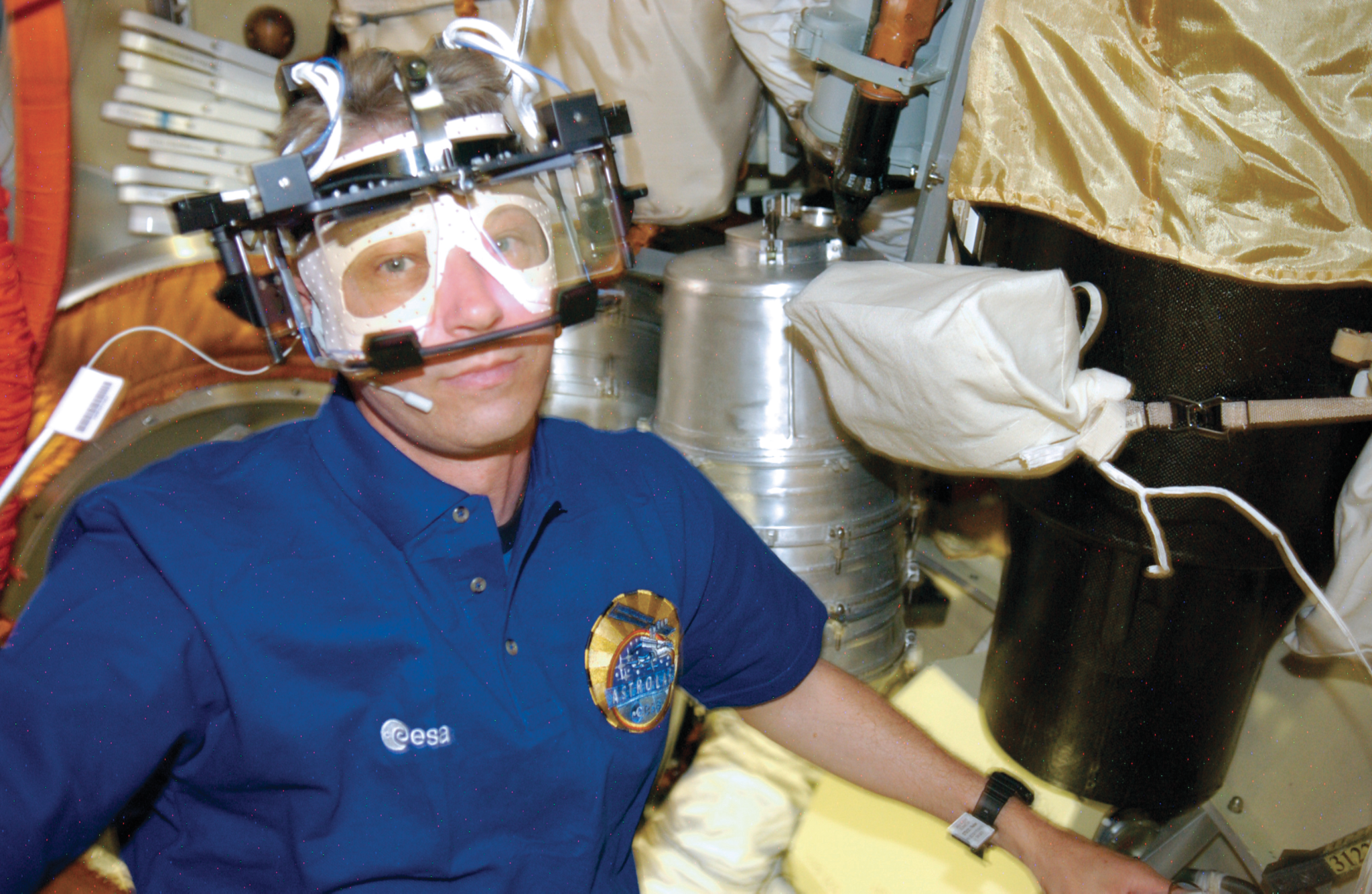 image of astronaut wearing eye testing device