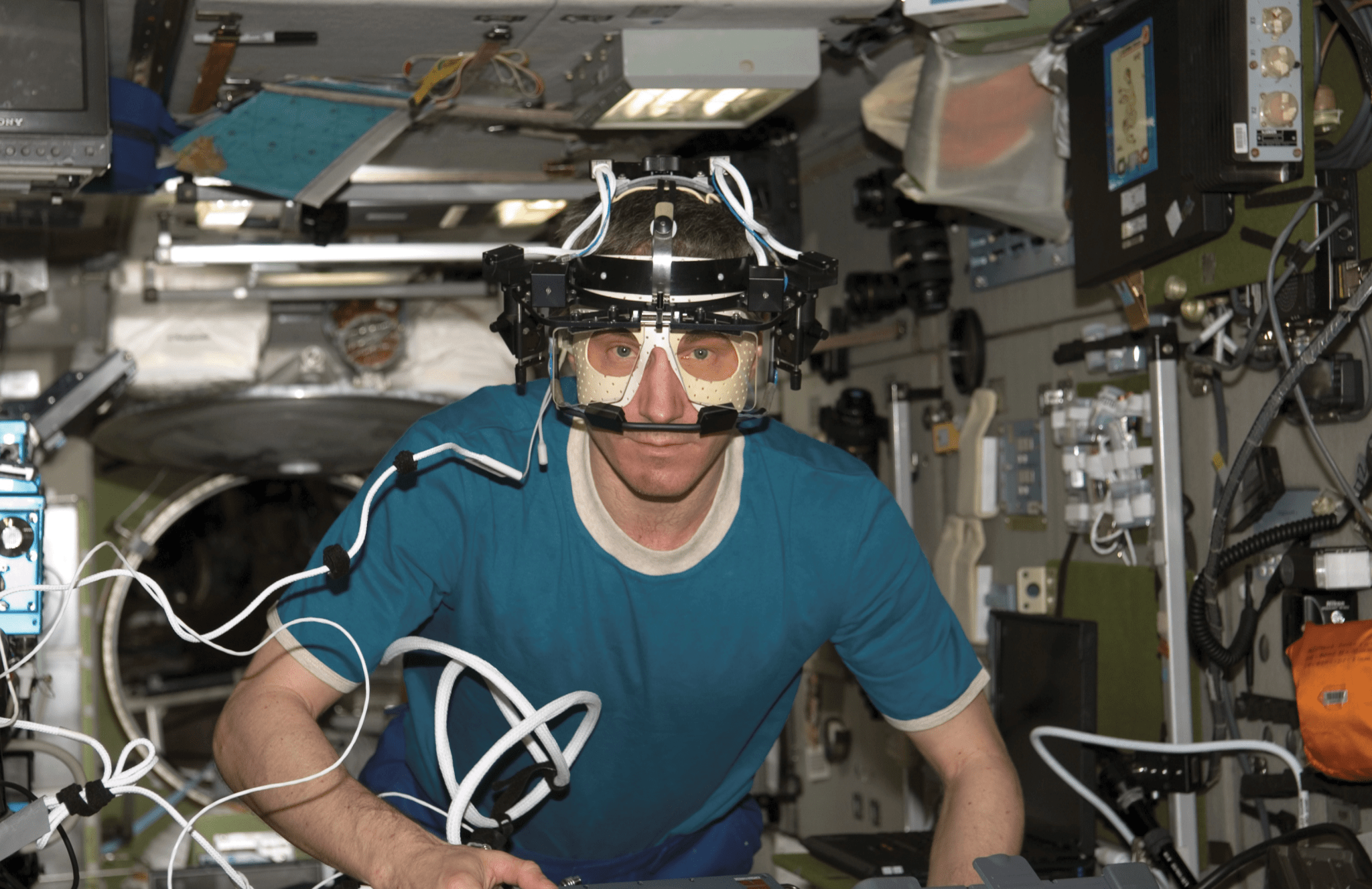 image of astronaut wearing eye testing device
