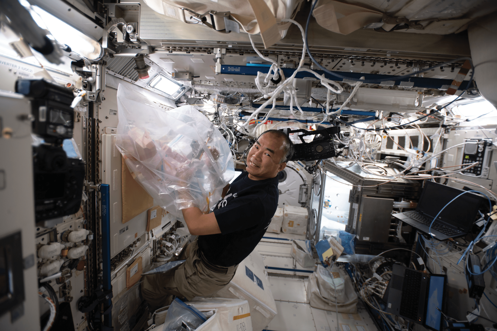 image of an astronaut working with an experiment