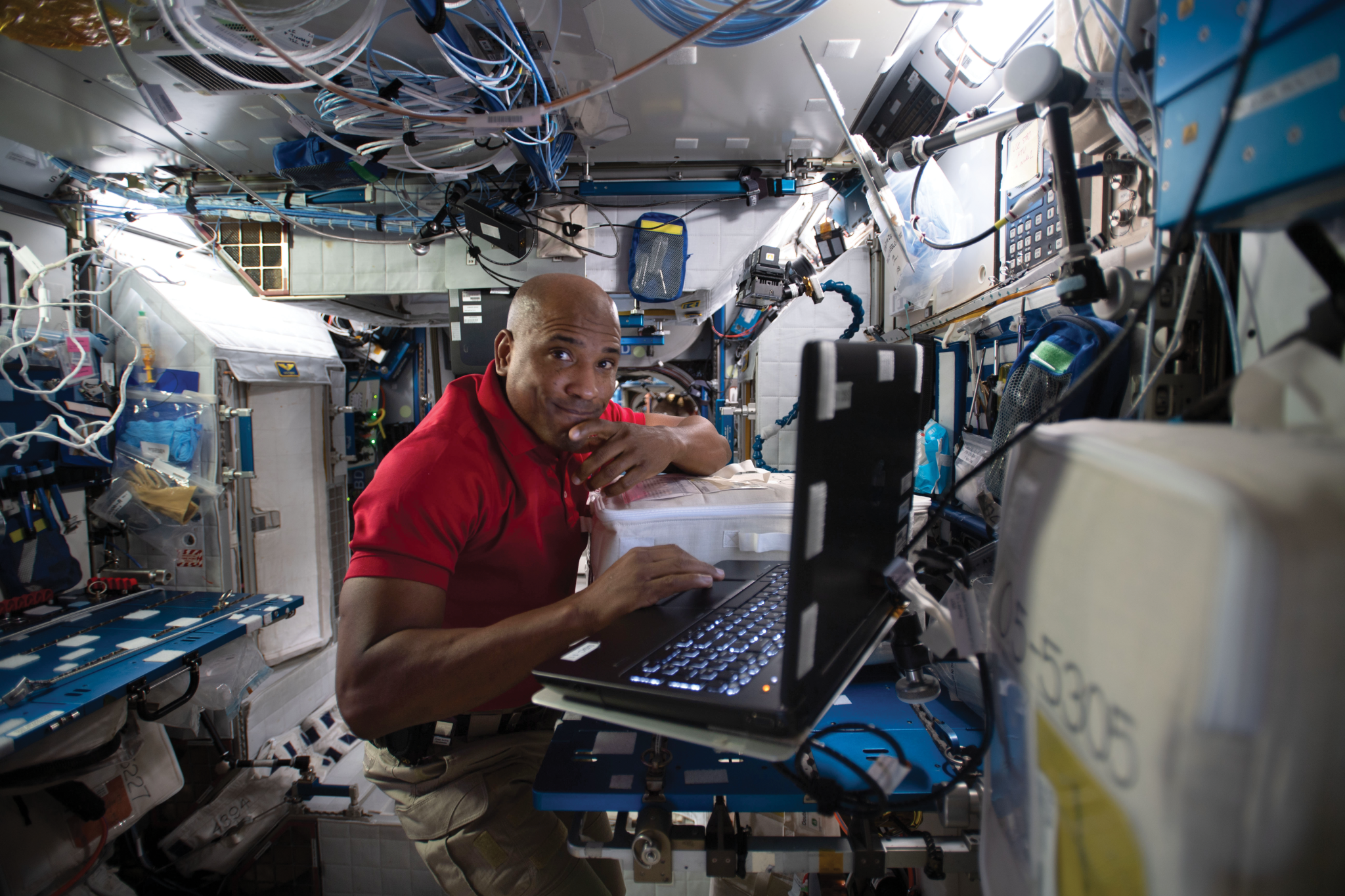 image of an astronaut working with an experiment