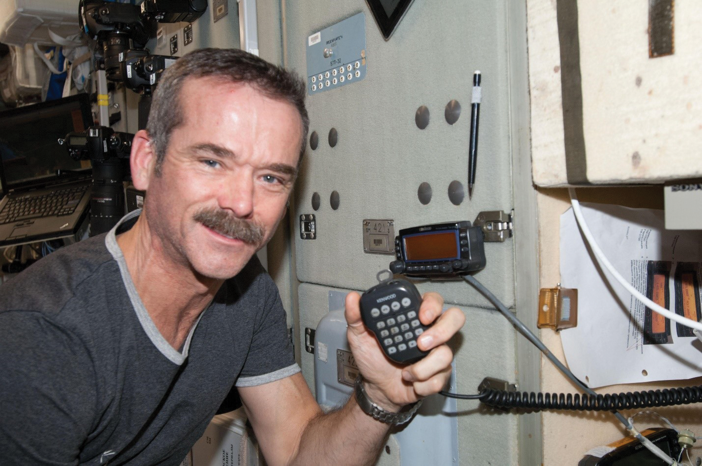 image of an astronaut using a ham radio