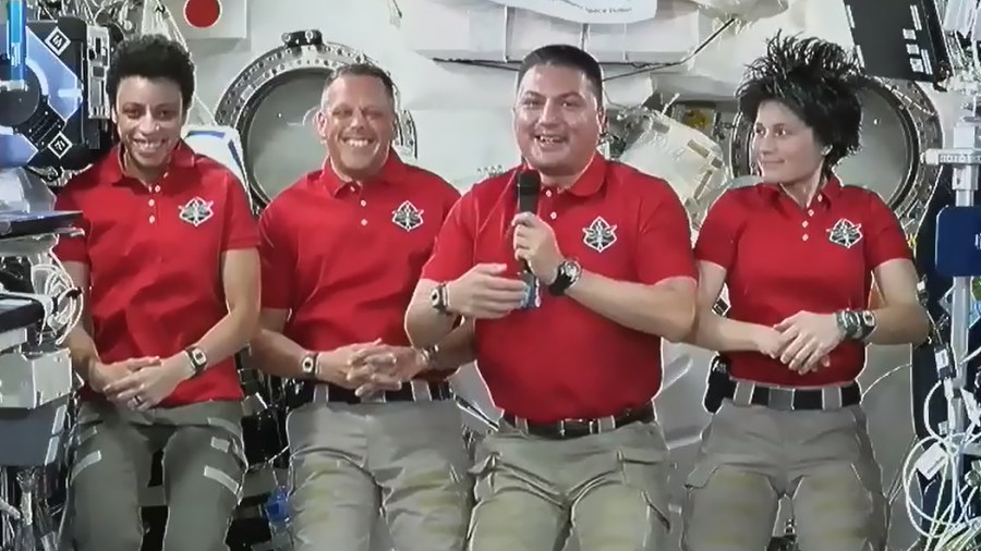 Astronauts (from left) Jessica Watkins, Bob Hines, Kjell Lindgren, and Samantha Cristoforetti share a light moment during an interview with officials on Earth.