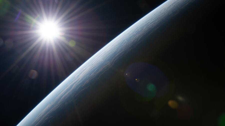 The sun's rays burst above Earth's horizon as the space station orbited 264 miles above Western Australia on the coast of Shark Bay.