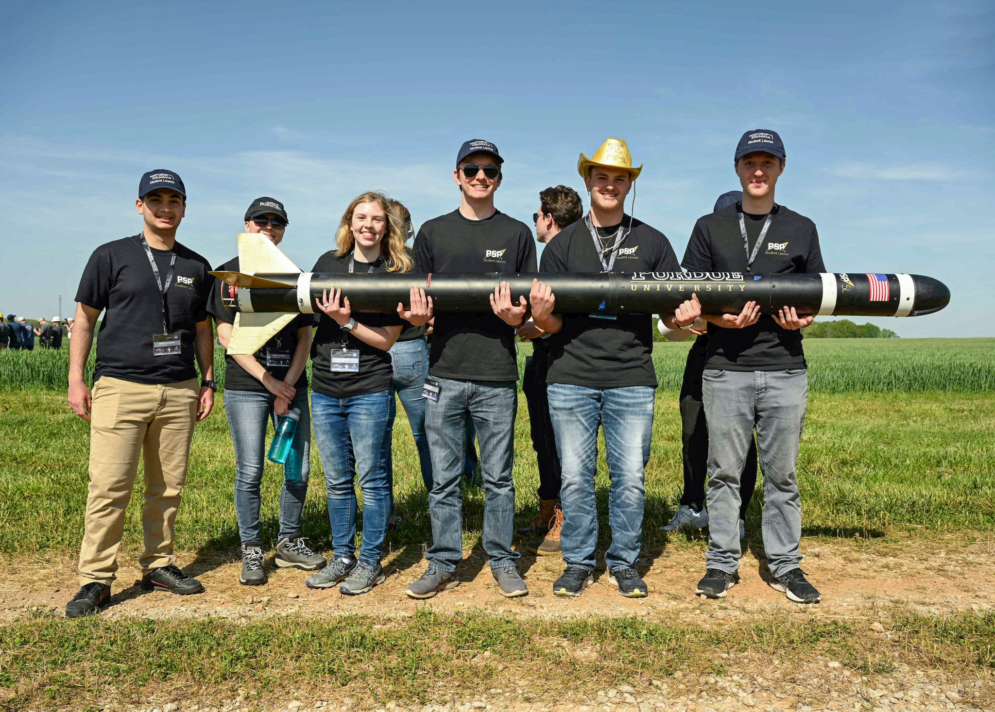 The student team from Purdue University in West Lafayette, Indiana, with their rocket. 