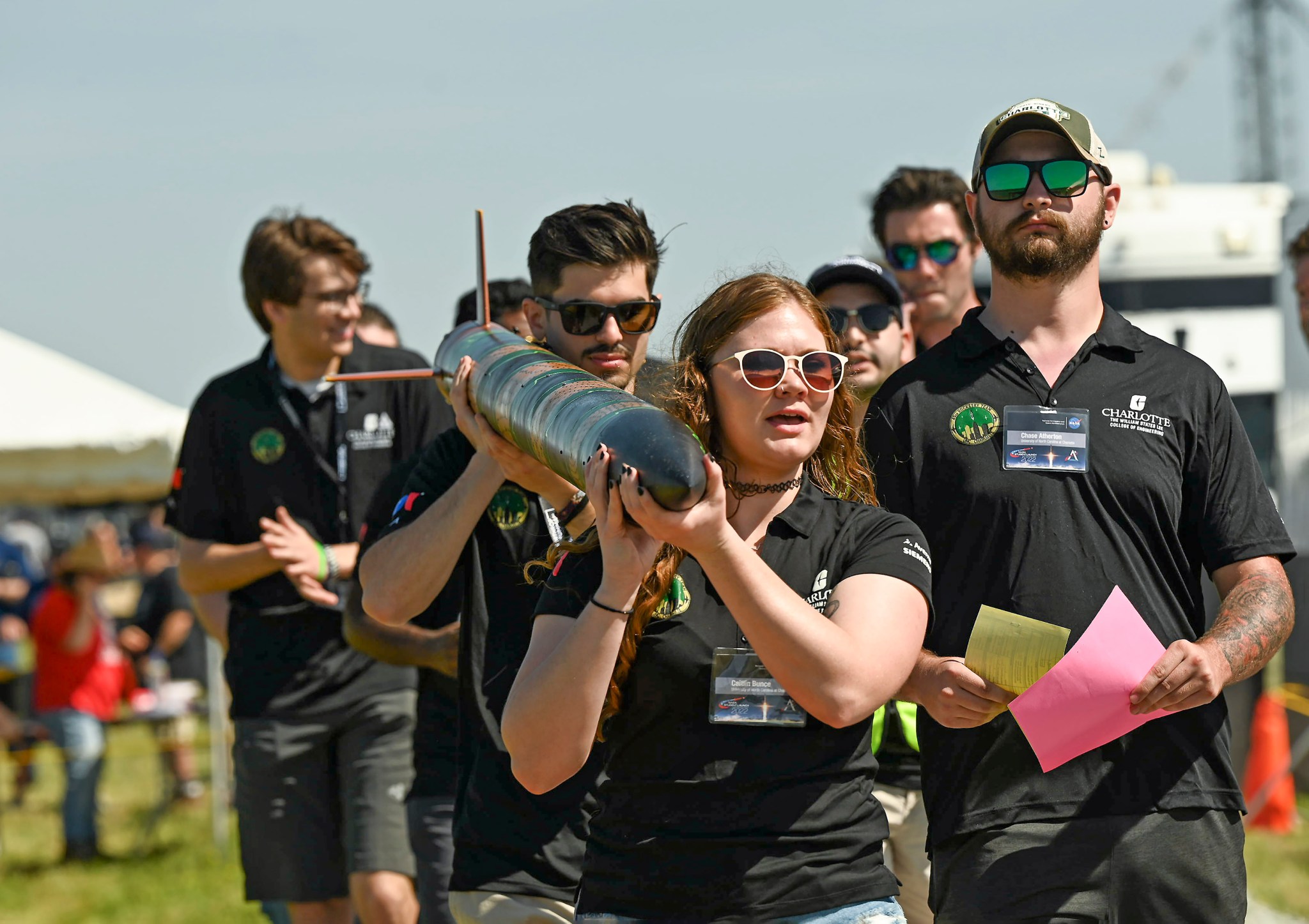 Team members from the University of North Carolina at Charlotte carry their rocket to the launch area near Marshall on April 23. 