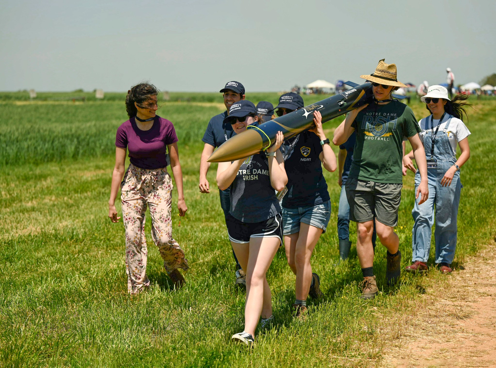 The student team from the University of Notre Dame in Notre Dame, Indiana, carries their rocket to the launch area. 