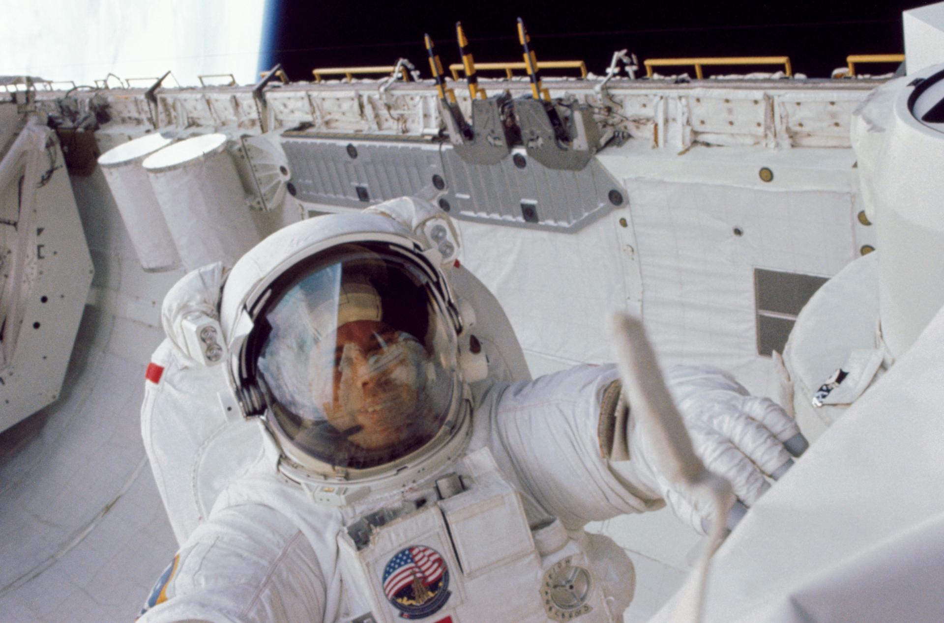 NASA astronaut David Leestma, ashe participates in an extravehicular activity on Oct. 11, 1984, during the STS-41G mission, in Challenger's aft cargo bay. 