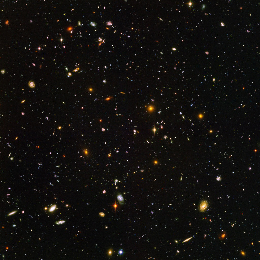 This Hubble Space Telescope image, known as the Hubble Ultra Deep Field, reveals about 10,000 galaxies and combines ultraviolet, visible, and near-infrared light.