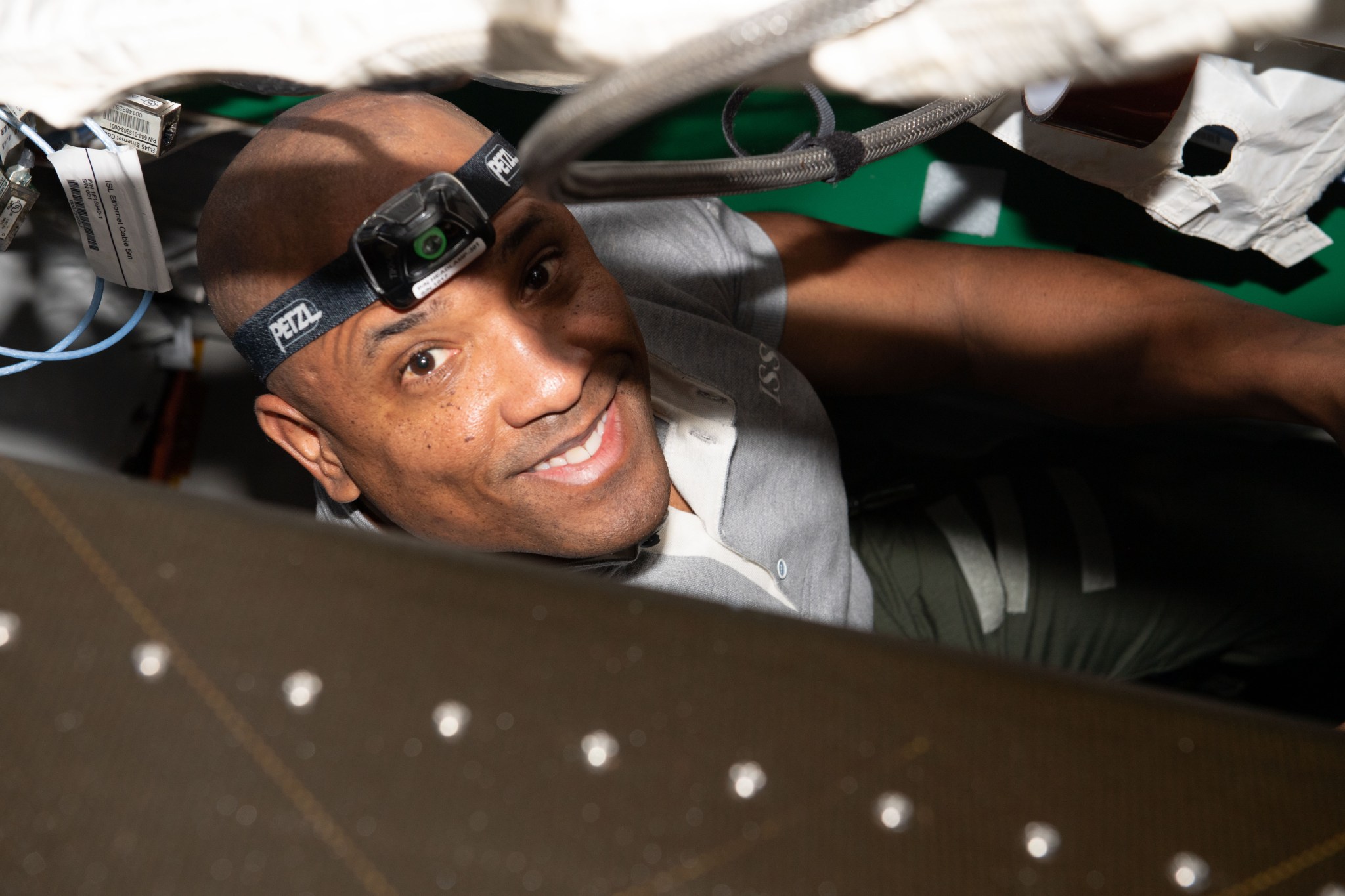 image of an astronaut doing maintenance on the space station