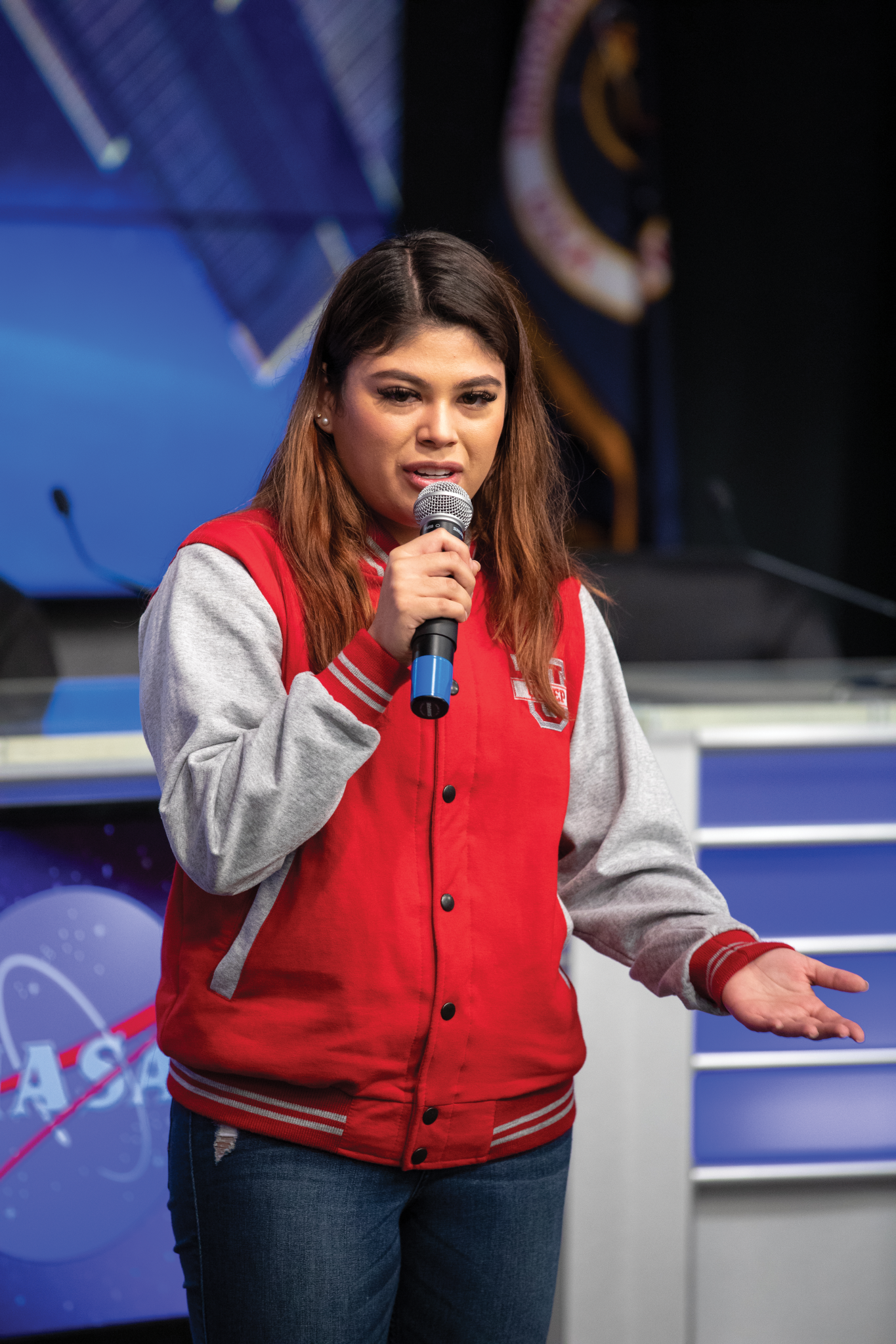 image of a student researcher speaking at an event