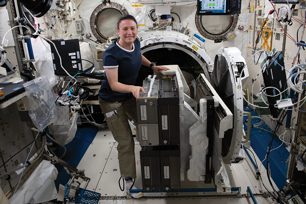 image of an astronaut loading up satellites for deployment