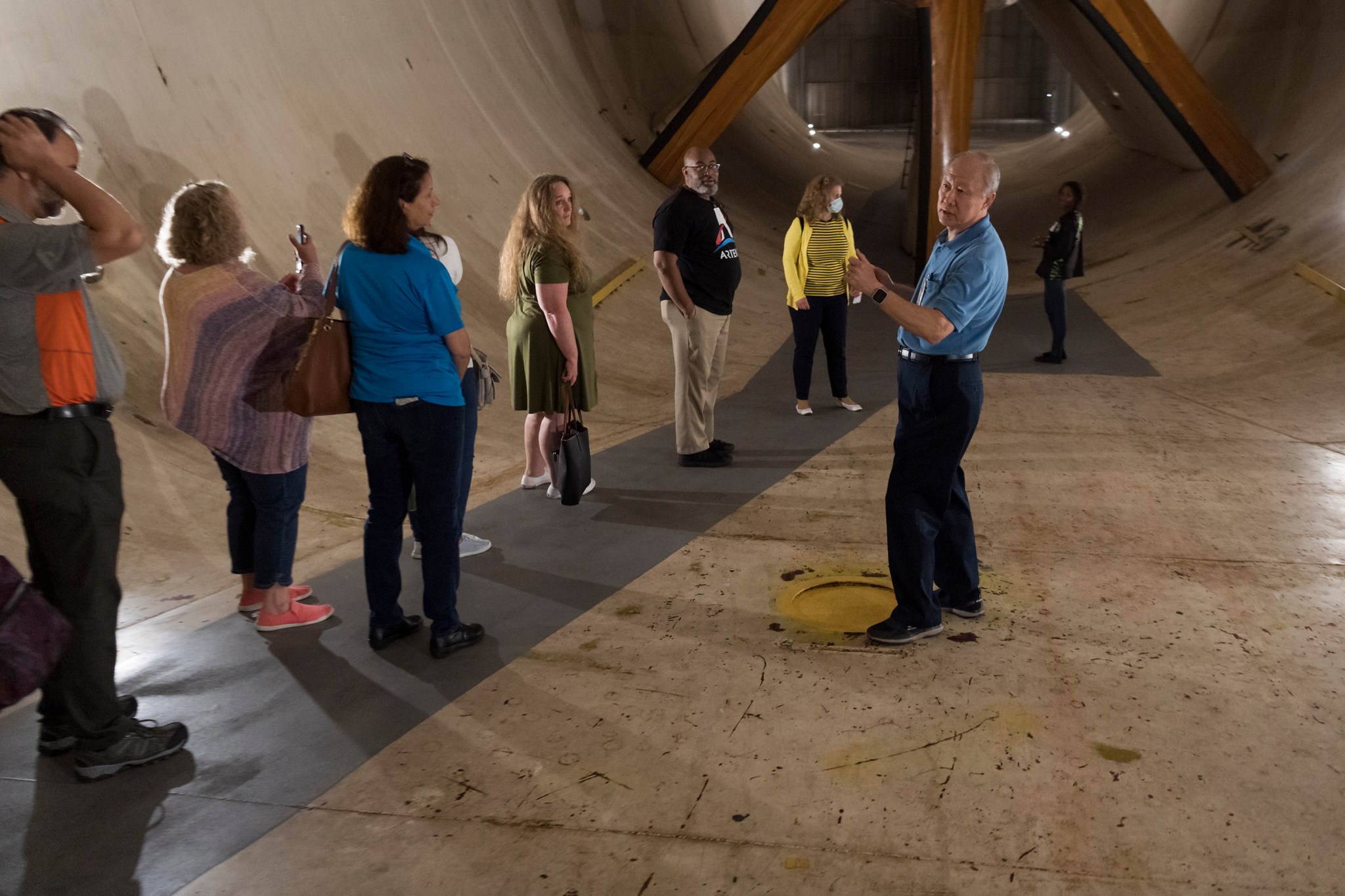 Frank Quinto, right, the 14- by 22-Foot Subsonic Tunnel facilities manager, gives a tour of the facility to the teachers.