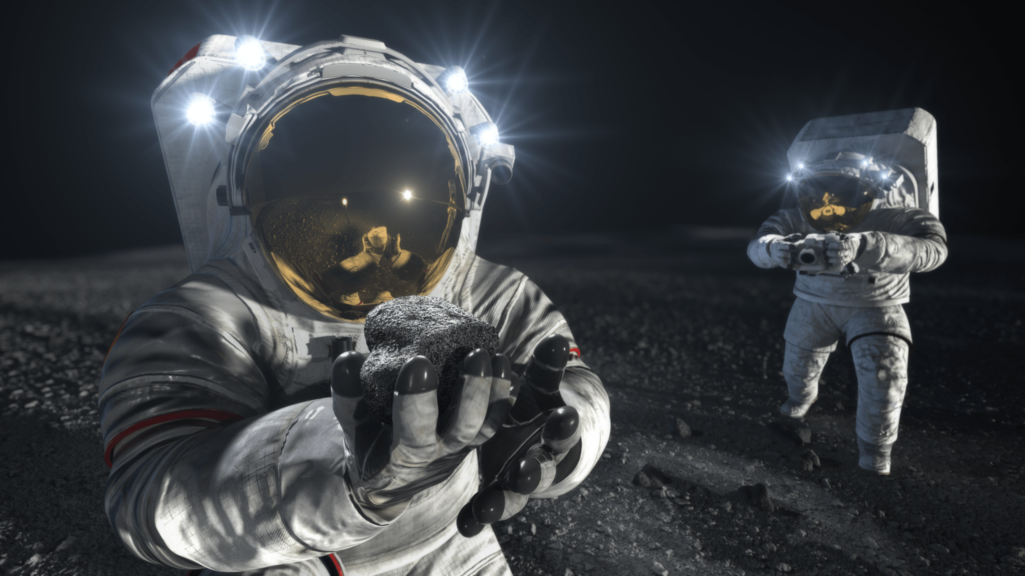 Artist’s Illustration: Two suited crew members work on the lunar surface. One in the foreground lifts a rock to examine it while the other photographs the collection site in the background.