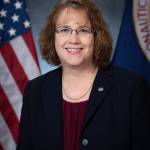 2022 Portrait of Dawn Schaible with U.S. and NASA flags in background
