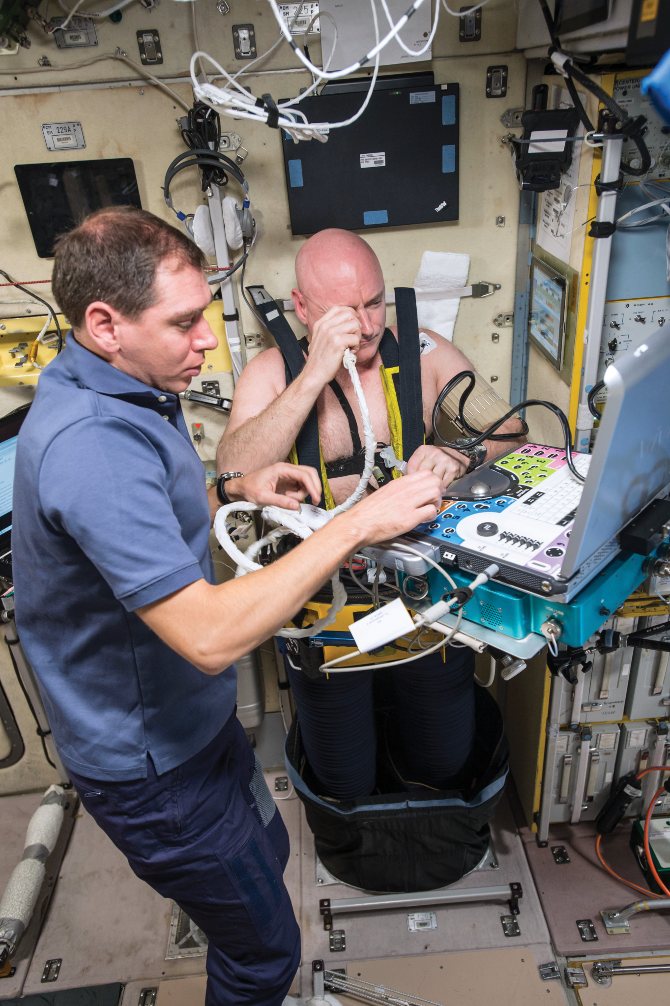 image of an astronaut running an ultrasound on another astronaut