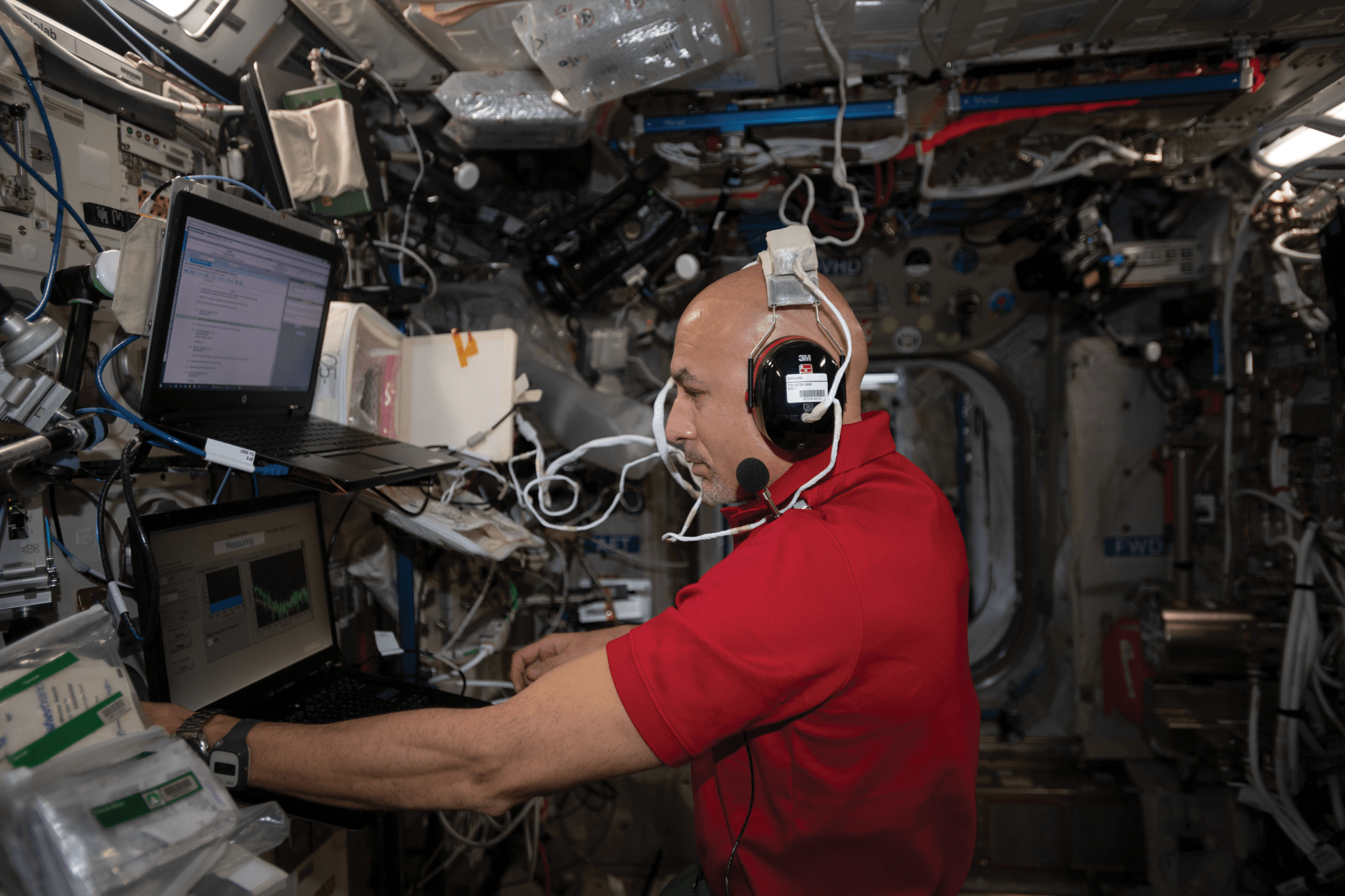 image of an astronaut conducting a hearing test