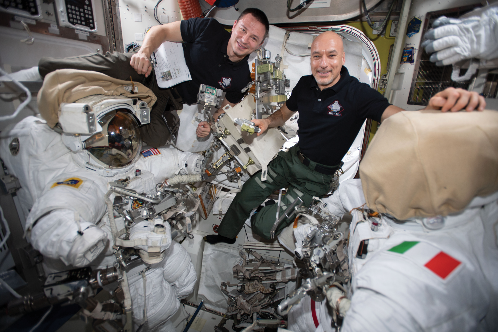 image of astronauts working with spacesuits