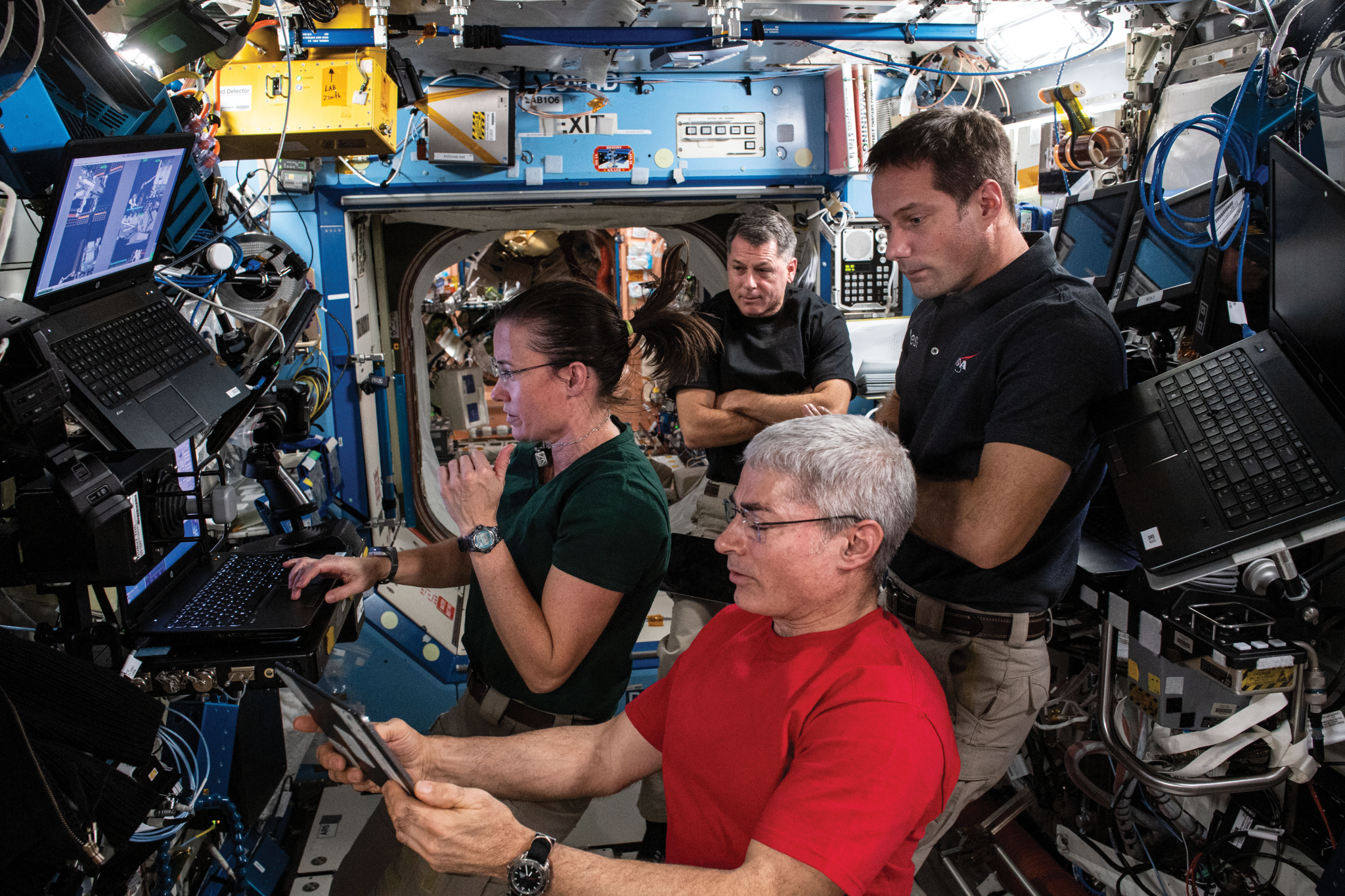 image of a crew of astronauts doing robotics training