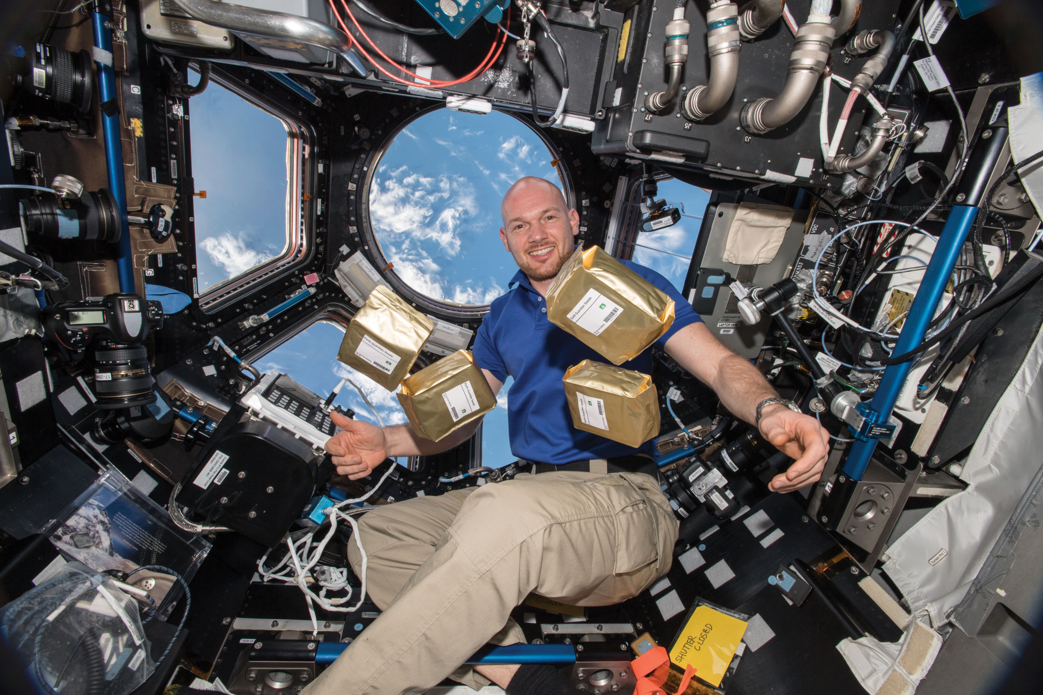 image of an astronaut with seed samples