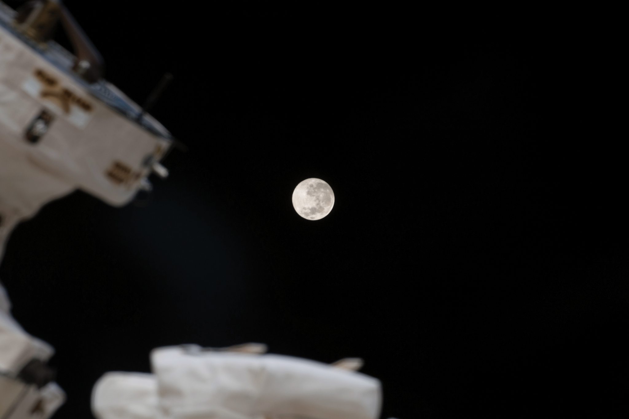 image of the moon and exterior of the space station