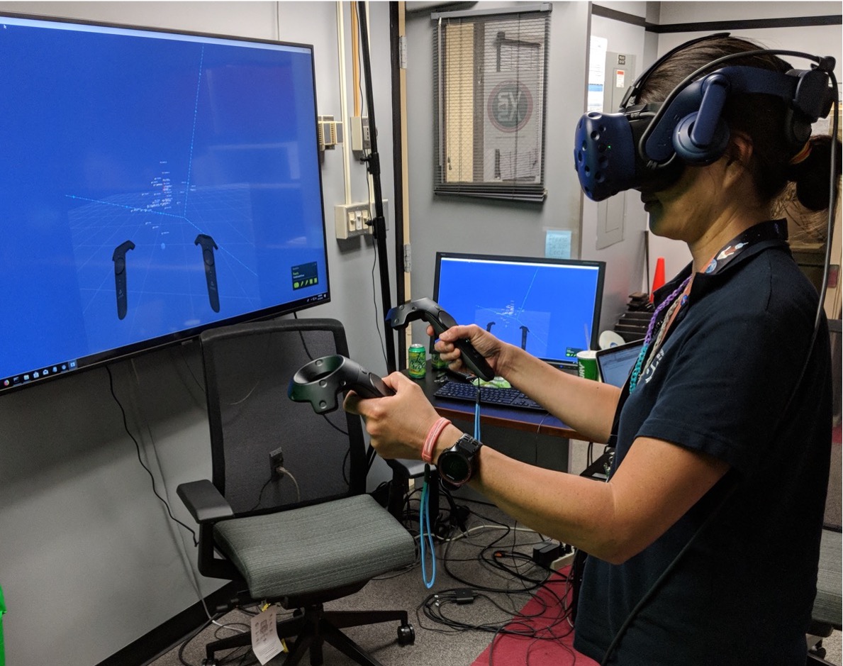 Susan Higashio uses a VR headset 