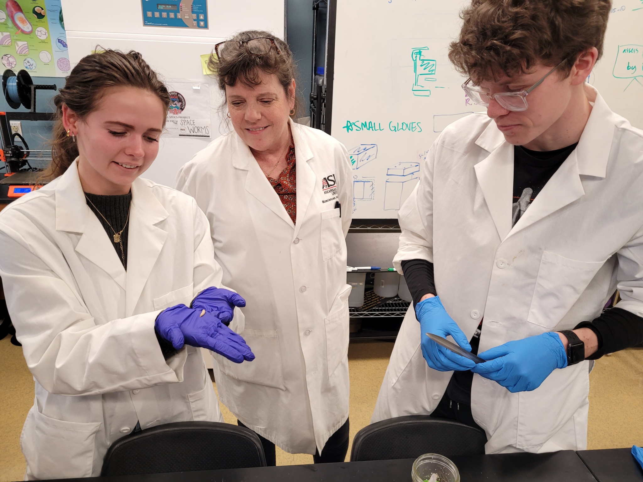 image of students showing the experiment sample