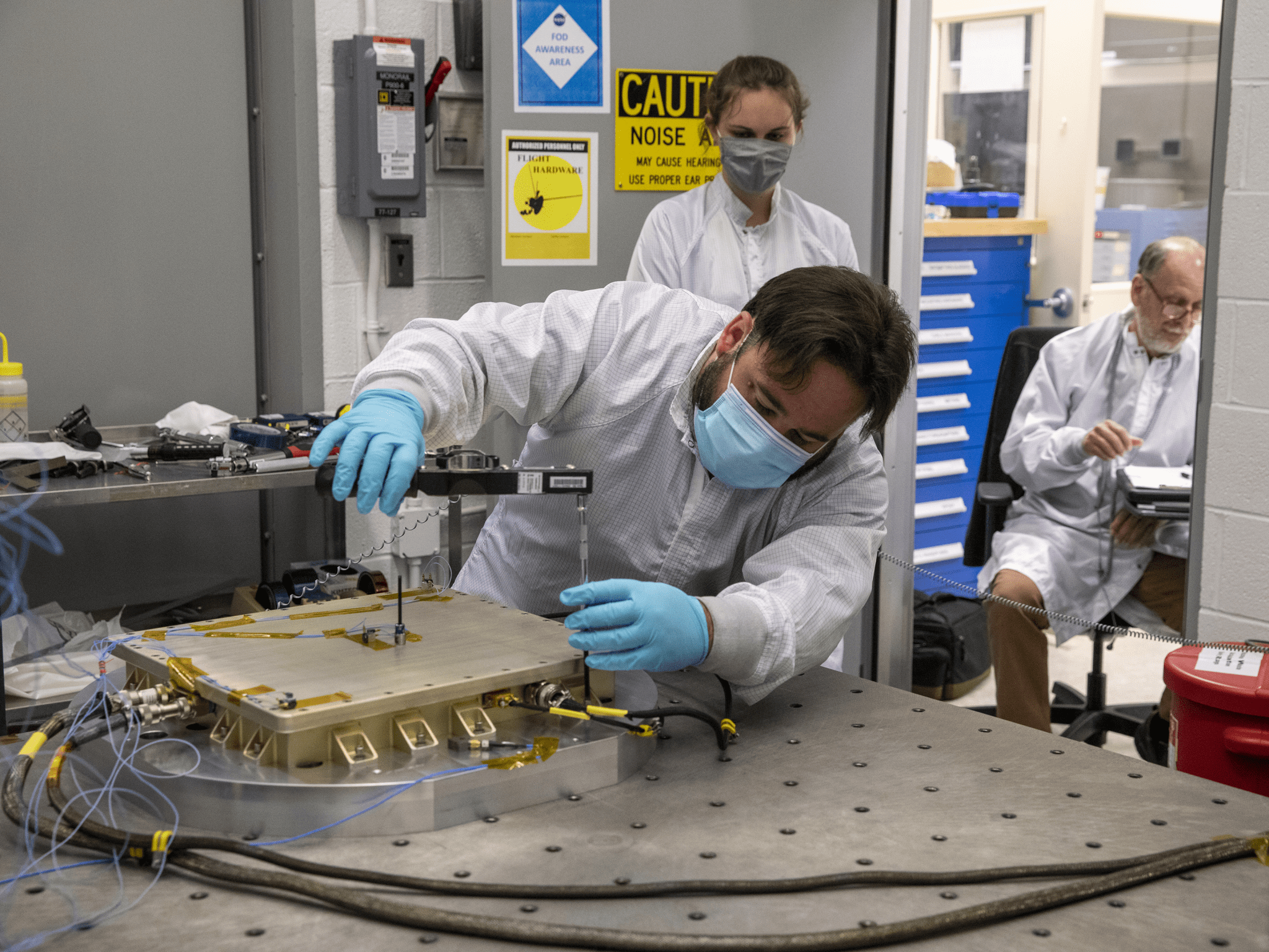 image of a technician testing experiment hardware